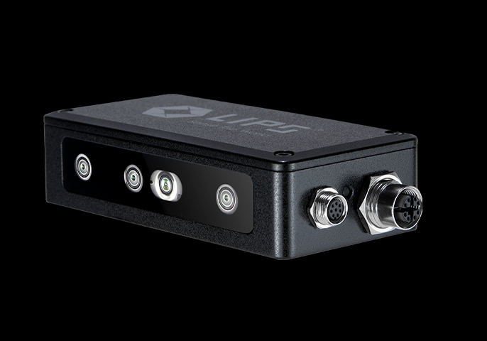 A compact black electronic device labeled "LIPS," featuring multiple sensors on the front panel and two metallic connectors on the side, set against a black background.