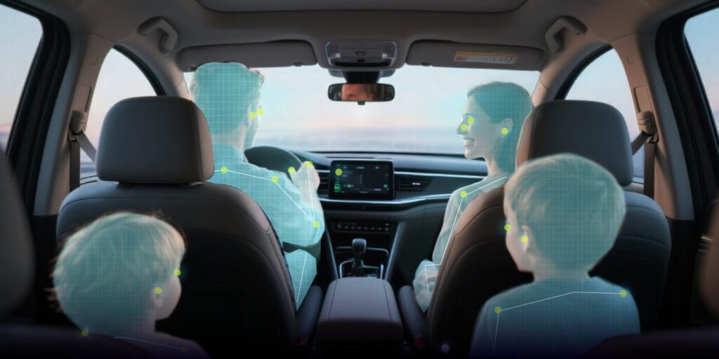 An interior view of a vehicle cabin demonstrating advanced in-cabin monitoring technology, featuring real-time 3D skeletal tracking and pose estimation for all occupants to enhance safety and personalize the driving experience.